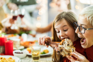 Grandmother-and-granddaughter-eating-turkey-leg-scaled