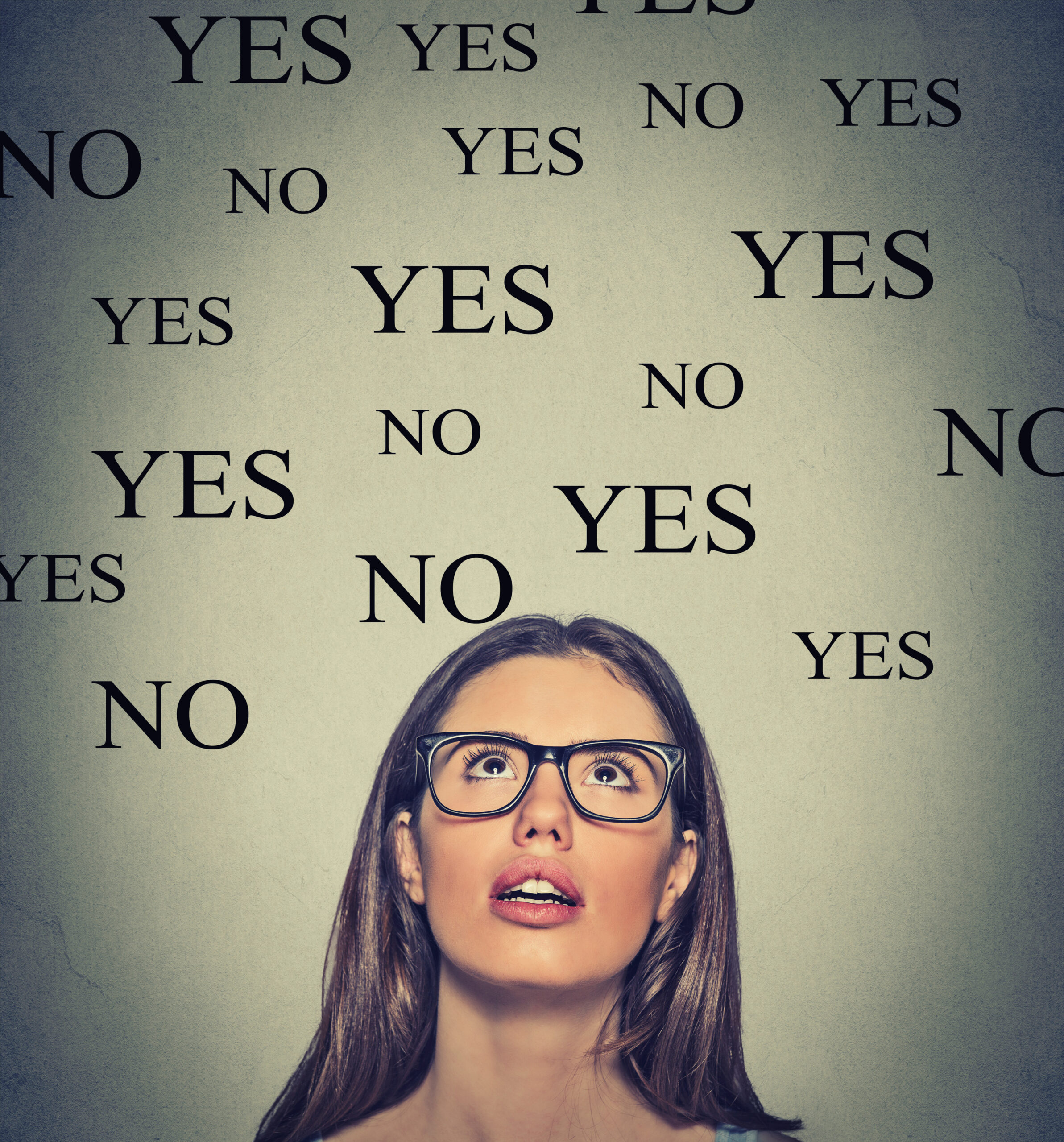 Women looking up and thinking with the words Yes and No laid out all above her head.